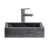 Lavabo Haumea de estilo colonial fabricado en piedra en color negro.