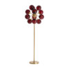 Lámpara de pie Alaia de estilo art deco fabricado en cristal en color burdeos combinado con hierro en color oro. Producto desmontable.